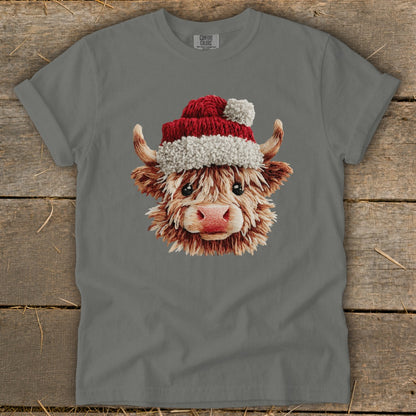 Highland cow with Santa hat graphic on gray t-shirt.