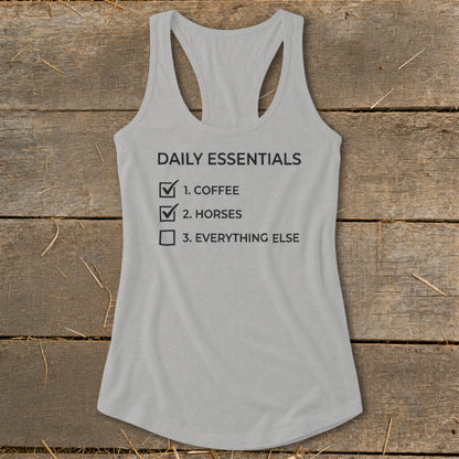 Grey tank top with "Daily Essentials" checklist including coffee, horses, and everything else.