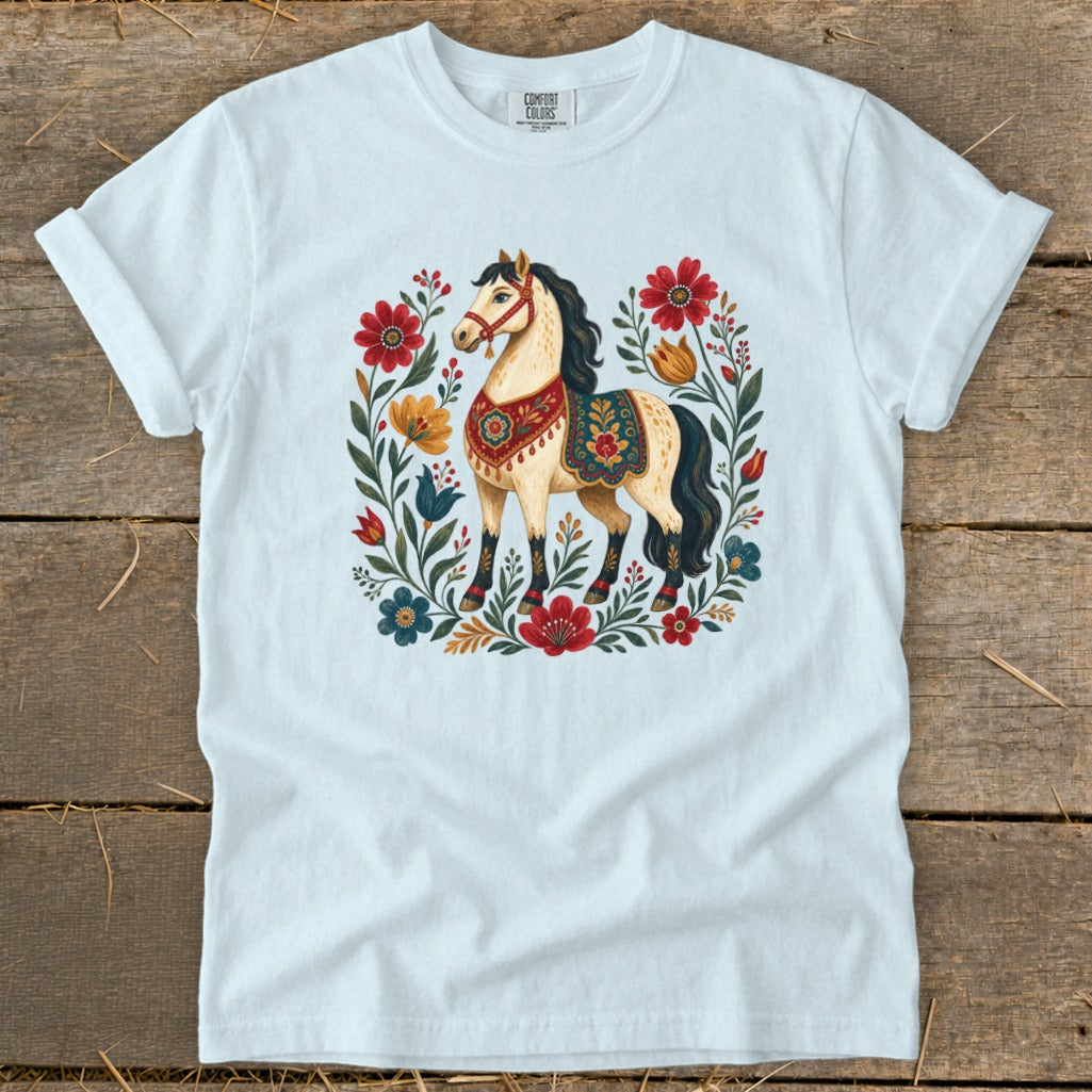 White t-shirt with a cream horse surrounded by colorful floral embroidery.