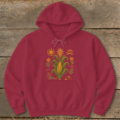 Maroon hoodie with a corn stalk, sun, flowers, and kernels graphic design.