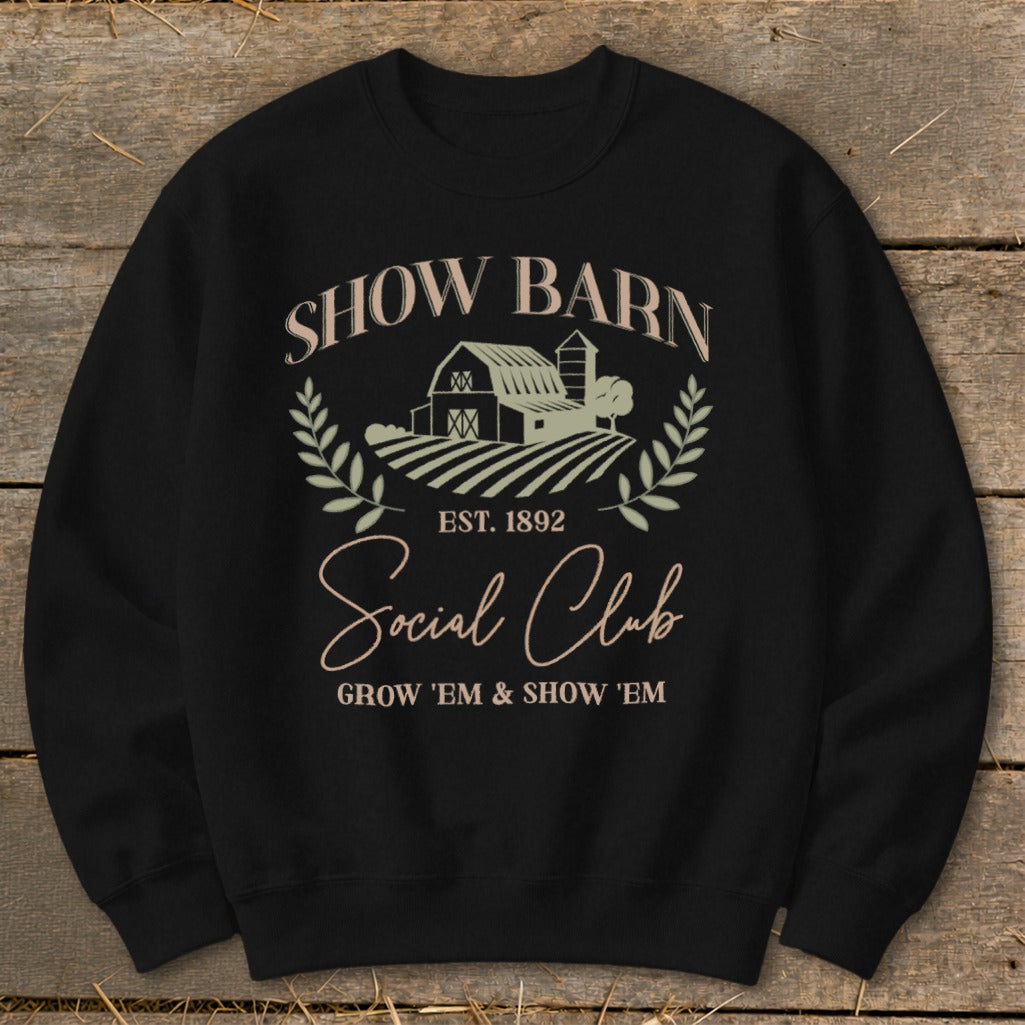 Black sweatshirt with "Show Barn Social Club" graphic and farm imagery.