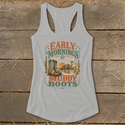 Grey tank top with "Early Mornings & Muddy Boots" graphic, featuring cowboy boots, barn, and sunset.