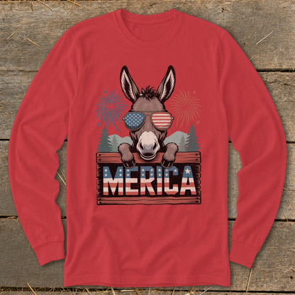 Donkey wearing American flag sunglasses holds wooden sign with "MERICA" text.