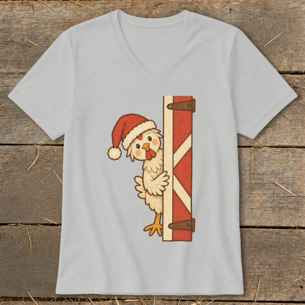 Cartoon chicken wearing Santa hat peeking from barn door.