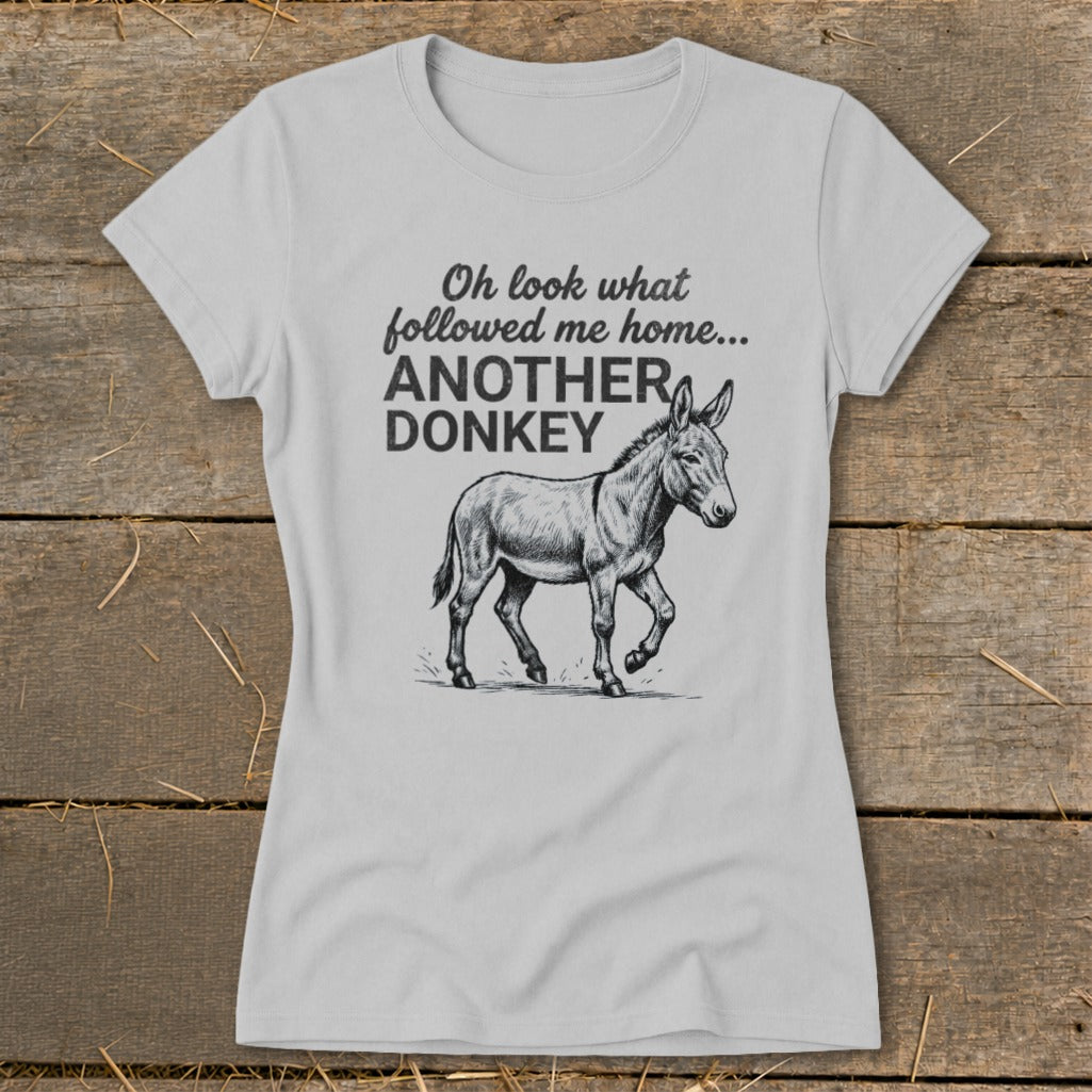 Light grey t-shirt with black text and donkey graphic that reads "Oh look what followed me home... ANOTHER DONKEY"