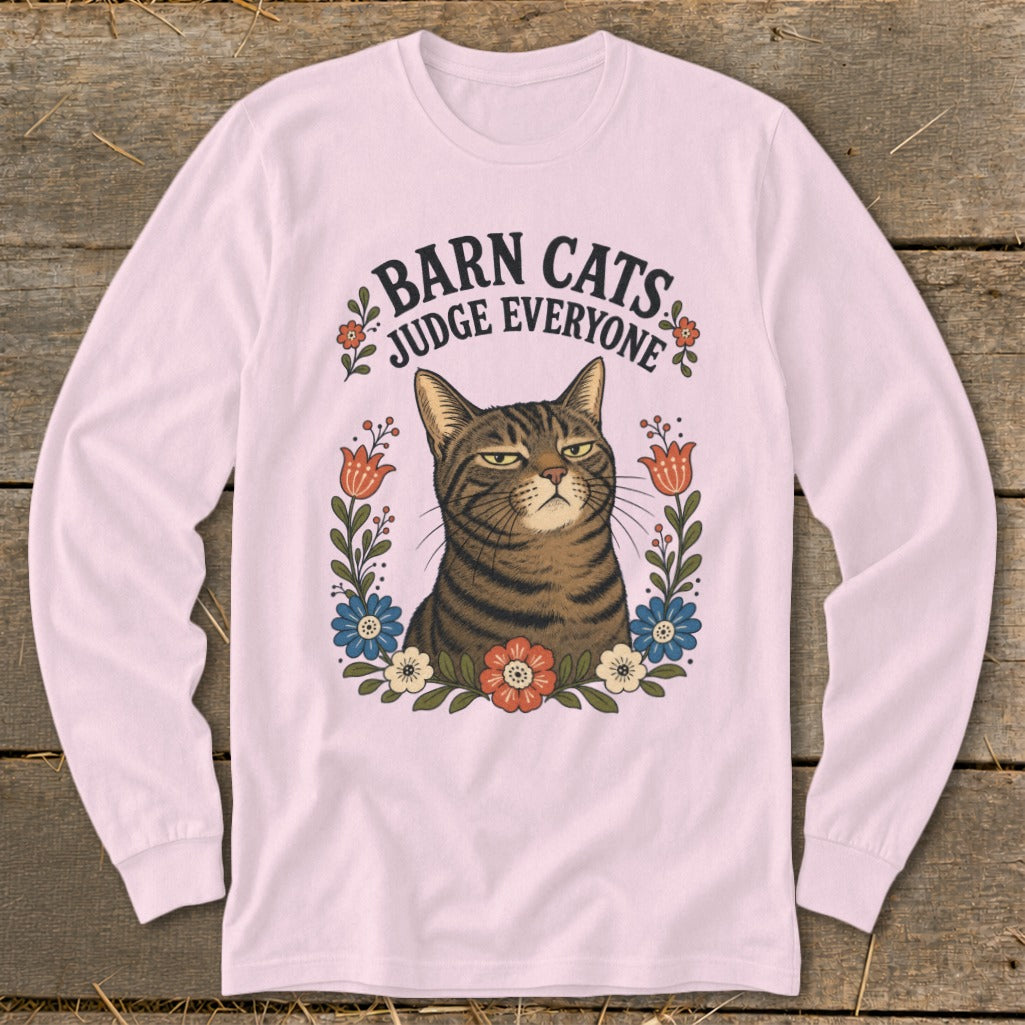 T-shirt graphic featuring a judgmental cat surrounded by flowers with text "Barn Cats Judge Everyone".