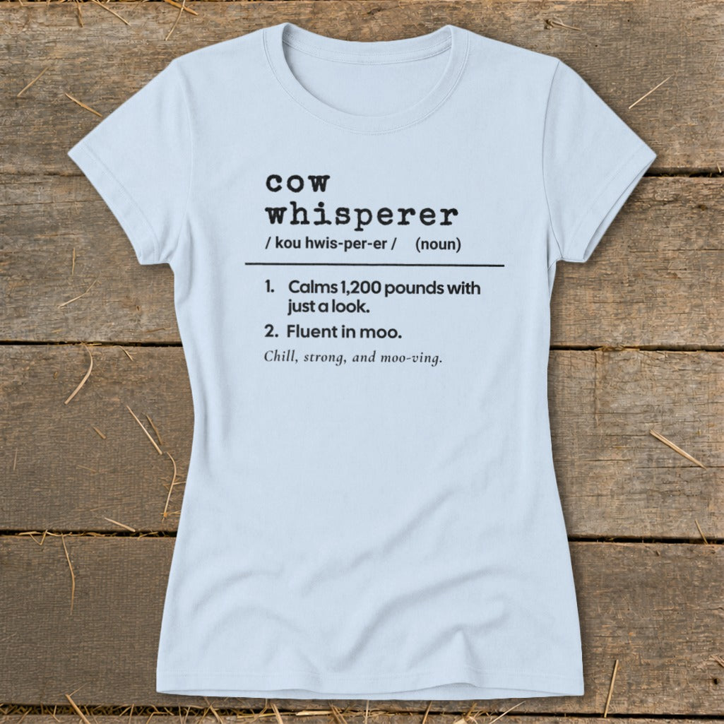 Light blue t-shirt with "Cow Whisperer" definition and humorous descriptions.