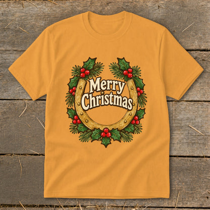 Orange t-shirt with a Christmas wreath featuring a horseshoe and "Merry Christmas" text.