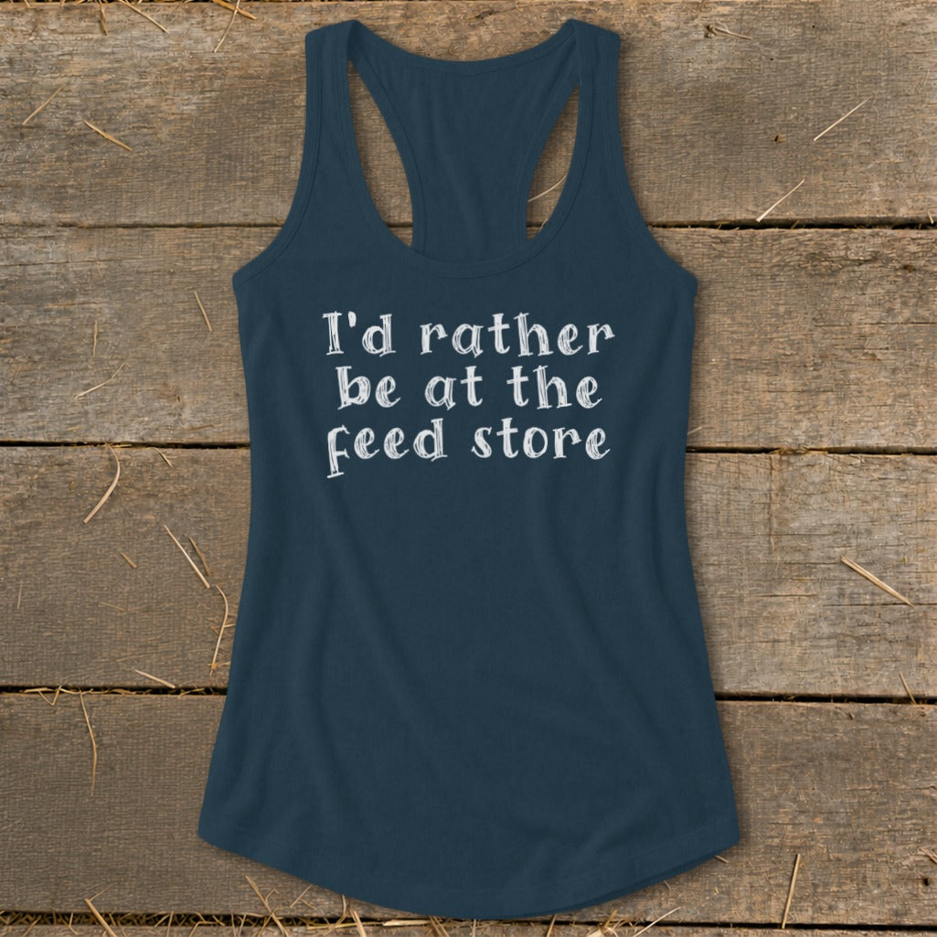 Navy tank top with white text that reads "I'd rather be at the feed store".