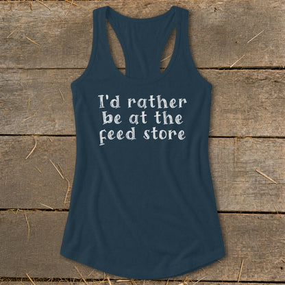 Navy tank top with white text that reads "I'd rather be at the feed store".