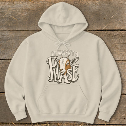 Cream hoodie with a goat graphic and text "IT WASN'T A PHASE".