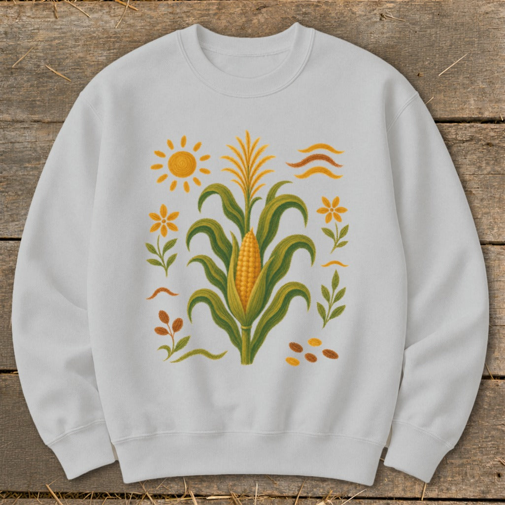 White sweatshirt with a corn stalk, sun, flowers, and leaves graphic.