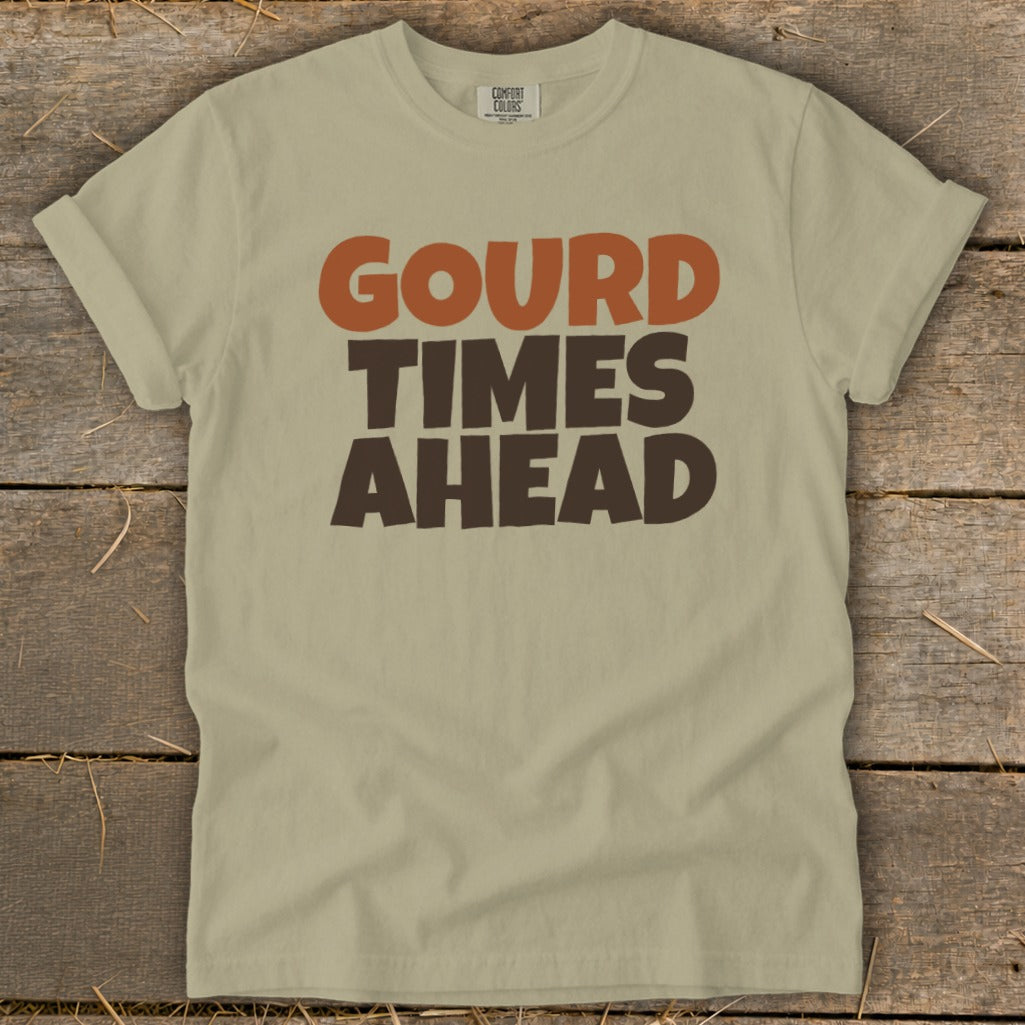 Light tan t-shirt with "GOURD TIMES AHEAD" graphic in brown and orange.