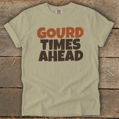 Light tan t-shirt with "GOURD TIMES AHEAD" graphic in brown and orange.
