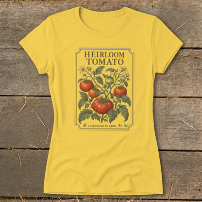 Yellow t-shirt with "Heirloom Tomato" seed packet design and tomatoes.
