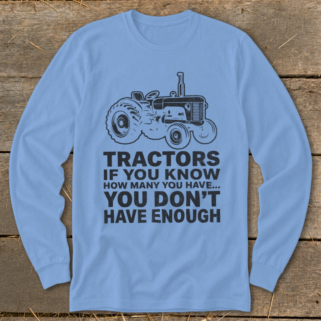 Light blue long sleeve shirt with a black tractor graphic and "Tractors If You Know How Many You Have... You Don't Have Enough" text.