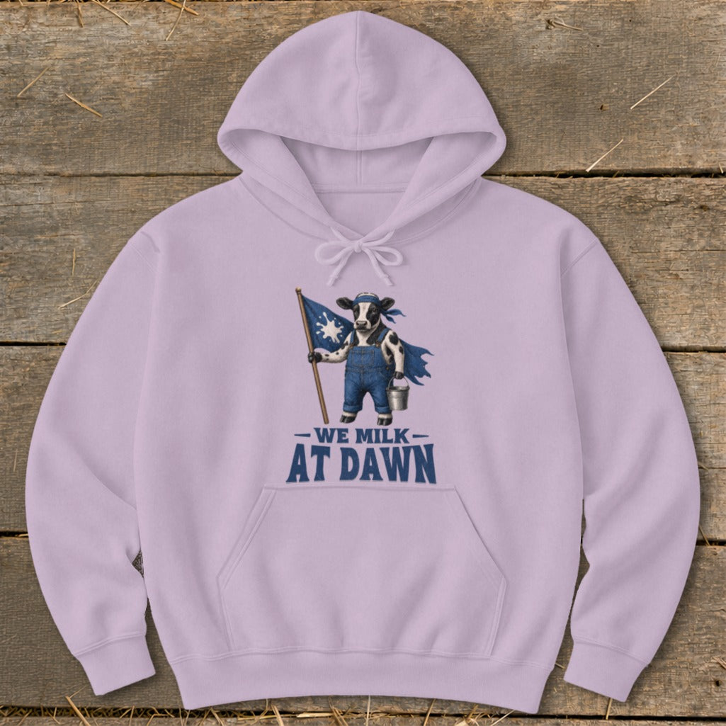 Light purple hoodie with a cow holding a flag and text "WE MILK AT DAWN".
