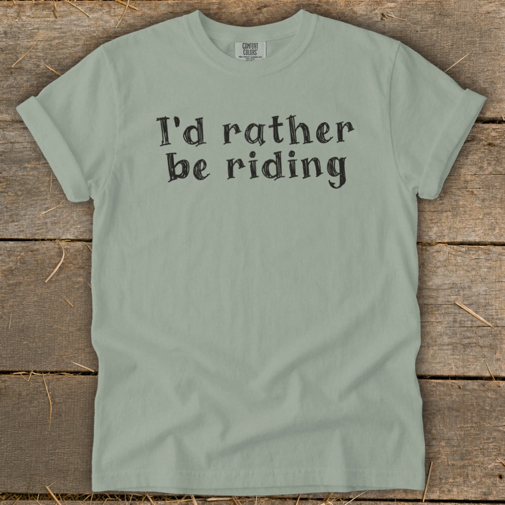 Light green t-shirt with black text that reads "I'd rather be riding".