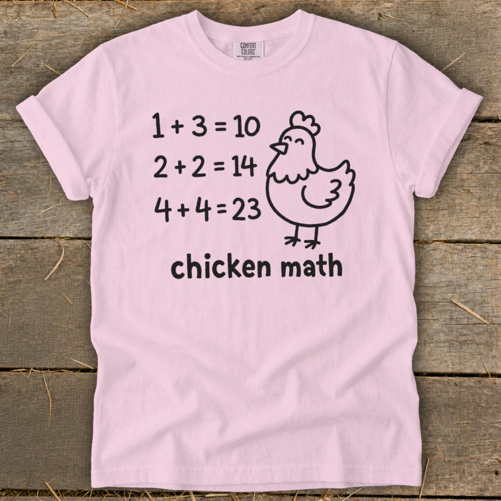 Pink t-shirt with "Chicken Math" and humorous math problems featuring a chicken.