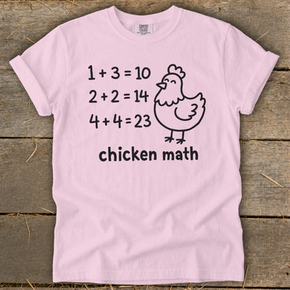 Pink t-shirt with "Chicken Math" and humorous math problems featuring a chicken.
