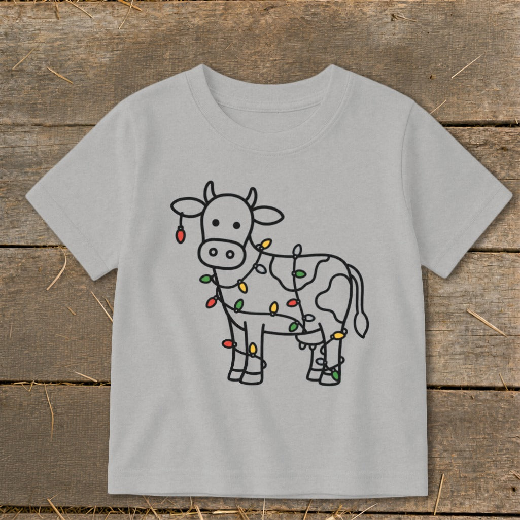 Grey t-shirt with a black outline of a cow wrapped in colorful Christmas lights.