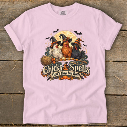 Three witch chickens on a broom with text "Chicks & Spells That's How We Roll!".