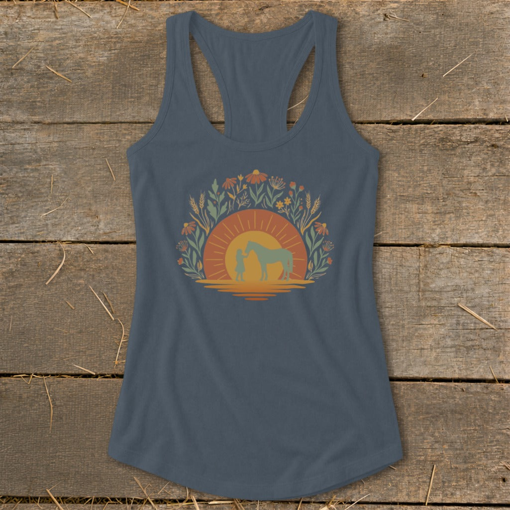 Tank top with a sunset and nature graphic featuring a child and horse.