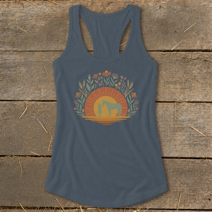 Tank top with a sunset and nature graphic featuring a child and horse.