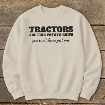 Cream sweatshirt with black text reading "TRACTORS ARE LIKE POTATO CHIPS you can't have just one".