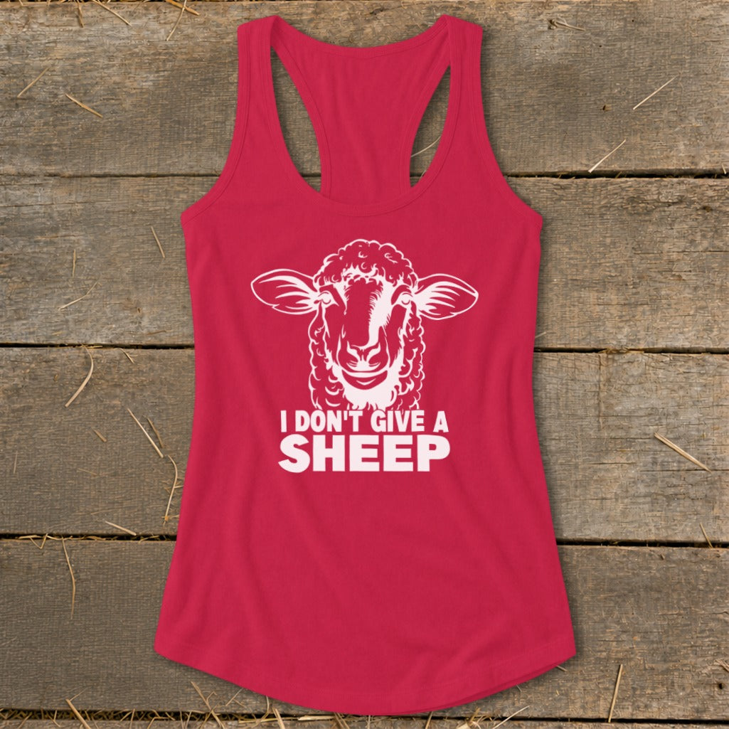 Pink tank top with white sheep graphic and "I DON'T GIVE A SHEEP" text.