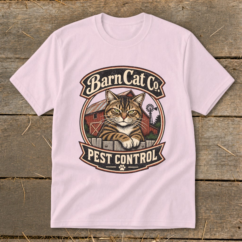 A light pink t-shirt displays a circular Barn Cat Co. Pest Control graphic featuring a tabby cat.