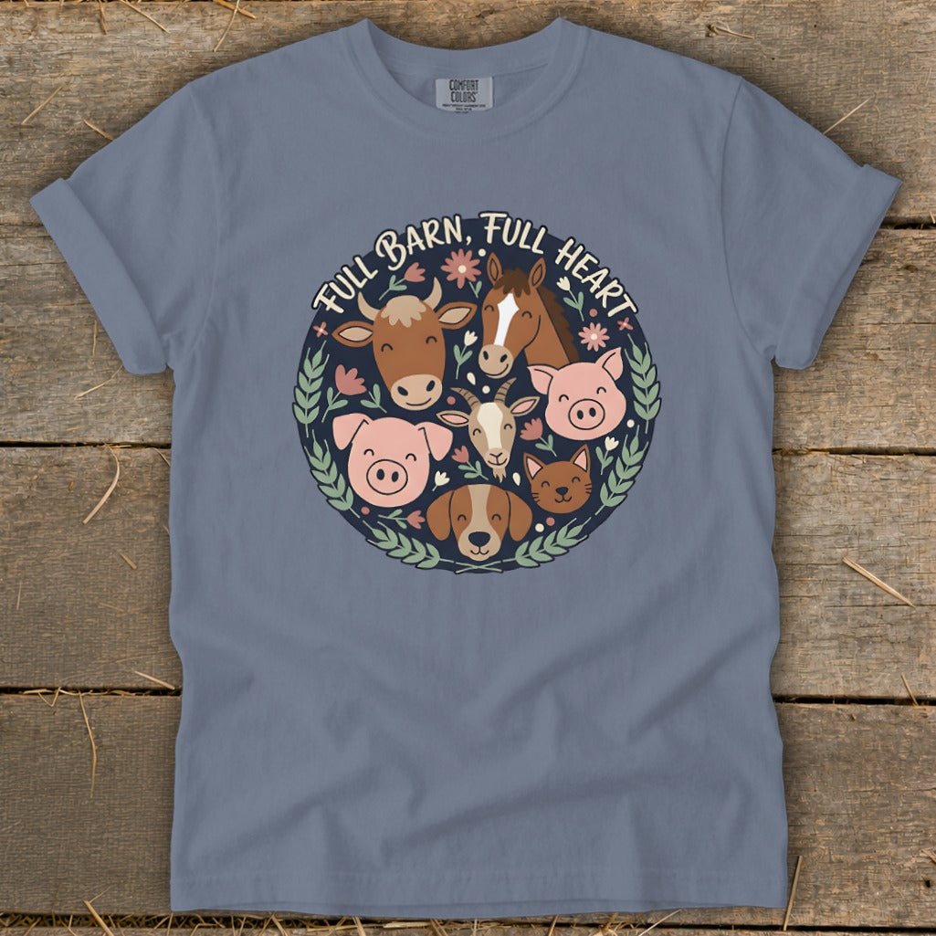 Blue t-shirt with a circular graphic of farm animals and the text "FULL BARN, FULL HEART".