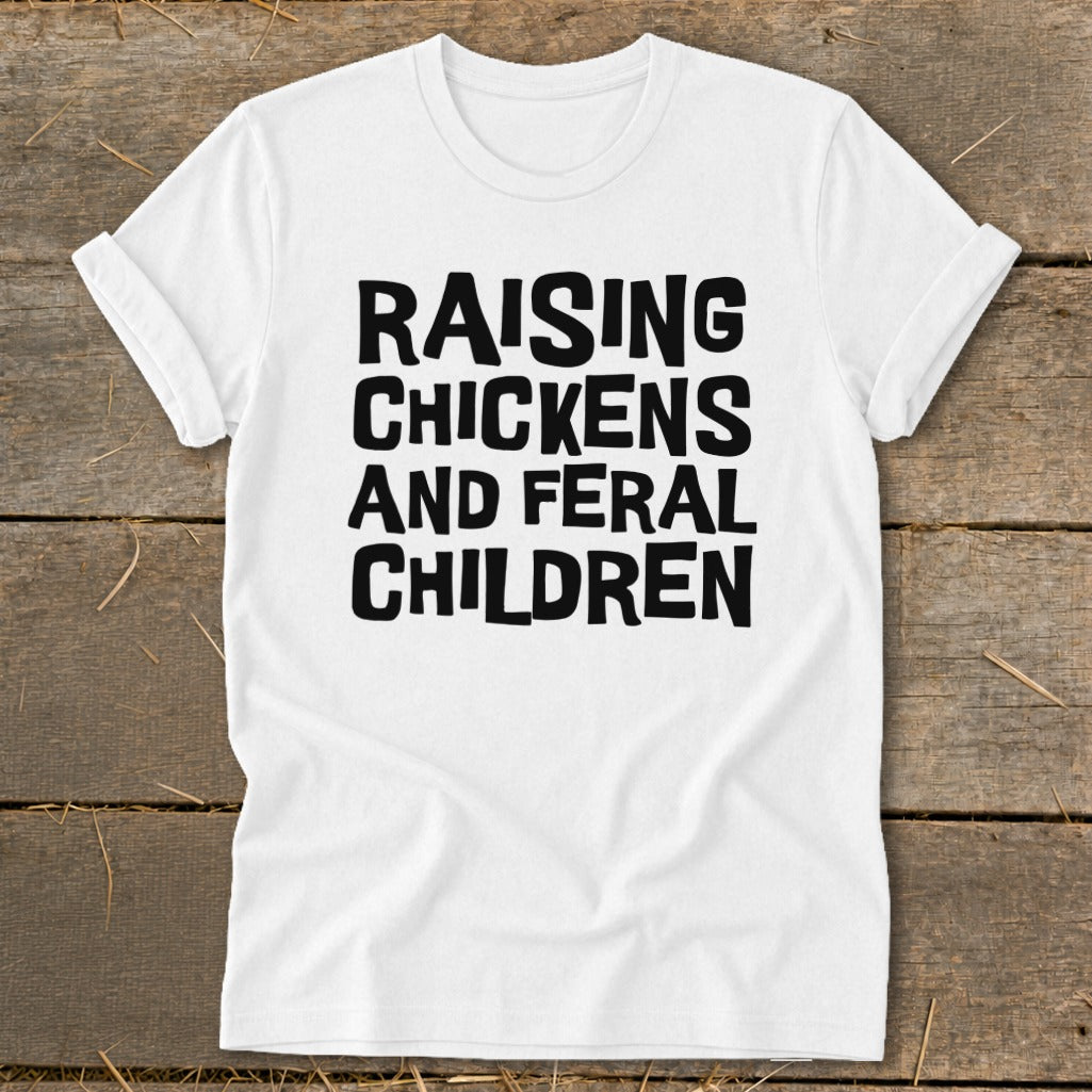 White t-shirt with black text "RAISING CHICKENS AND FERAL CHILDREN".