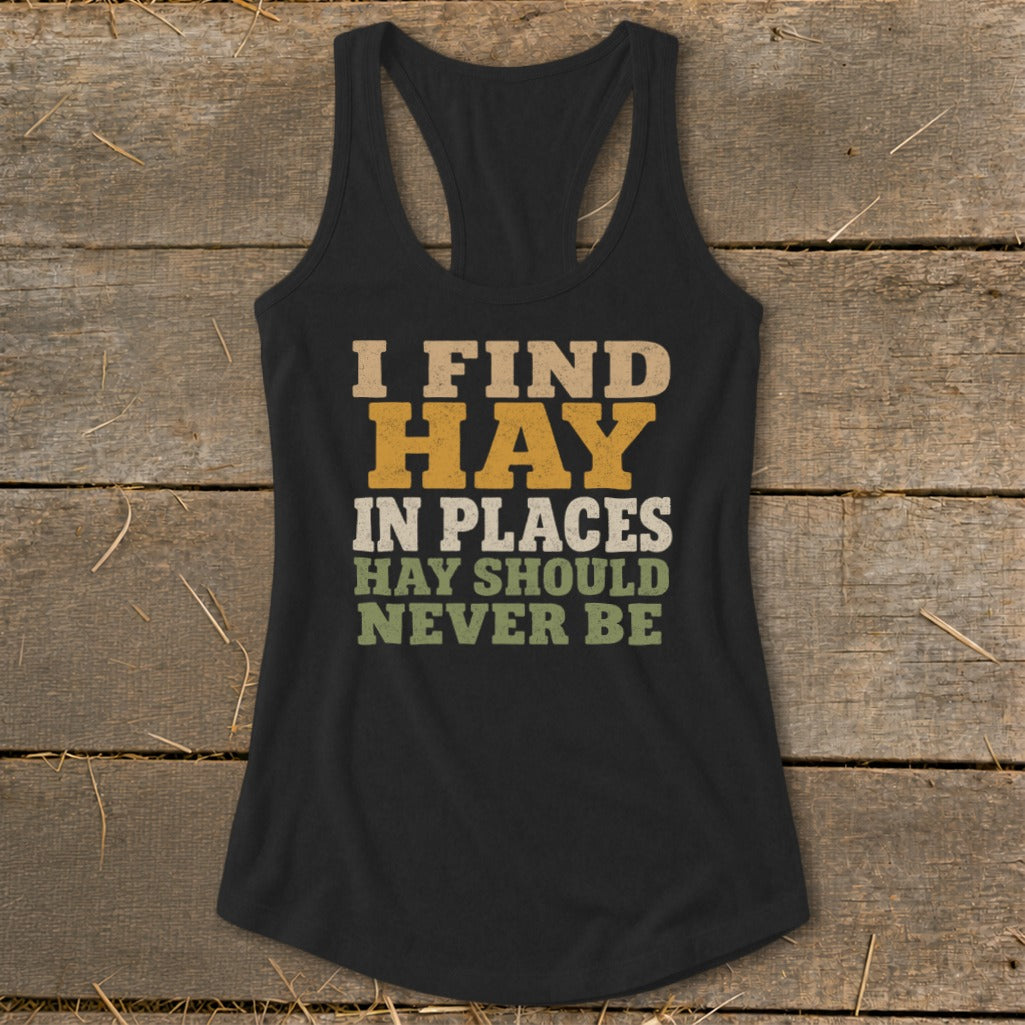 Black tank top with "I FIND HAY IN PLACES HAY SHOULD NEVER BE" text.