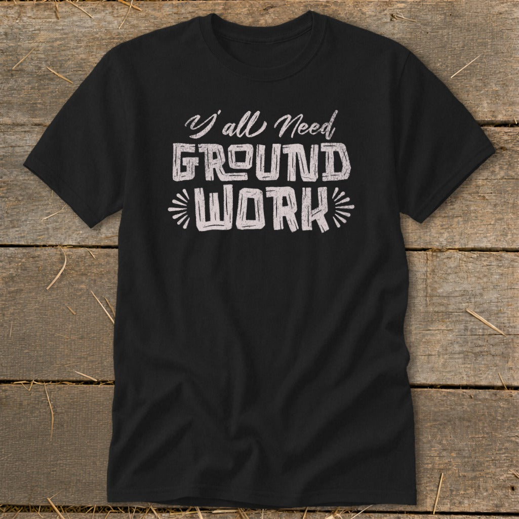 Black t-shirt with white text "Y'all Need GROUND WORK"