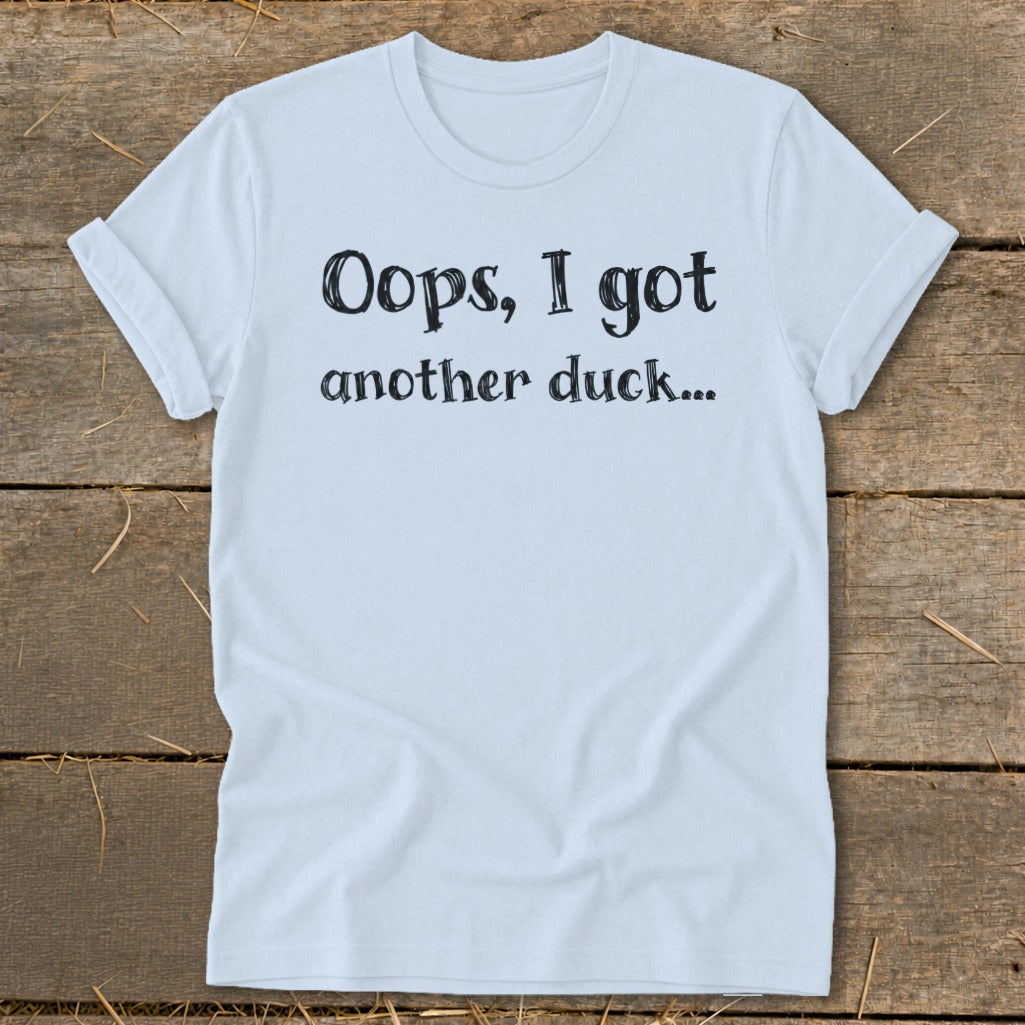 Light blue t-shirt with black text reading "Oops, I got another duck..."