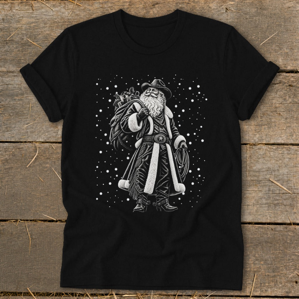 Black t-shirt with a cowboy Santa Claus graphic holding a sack and lasso.
