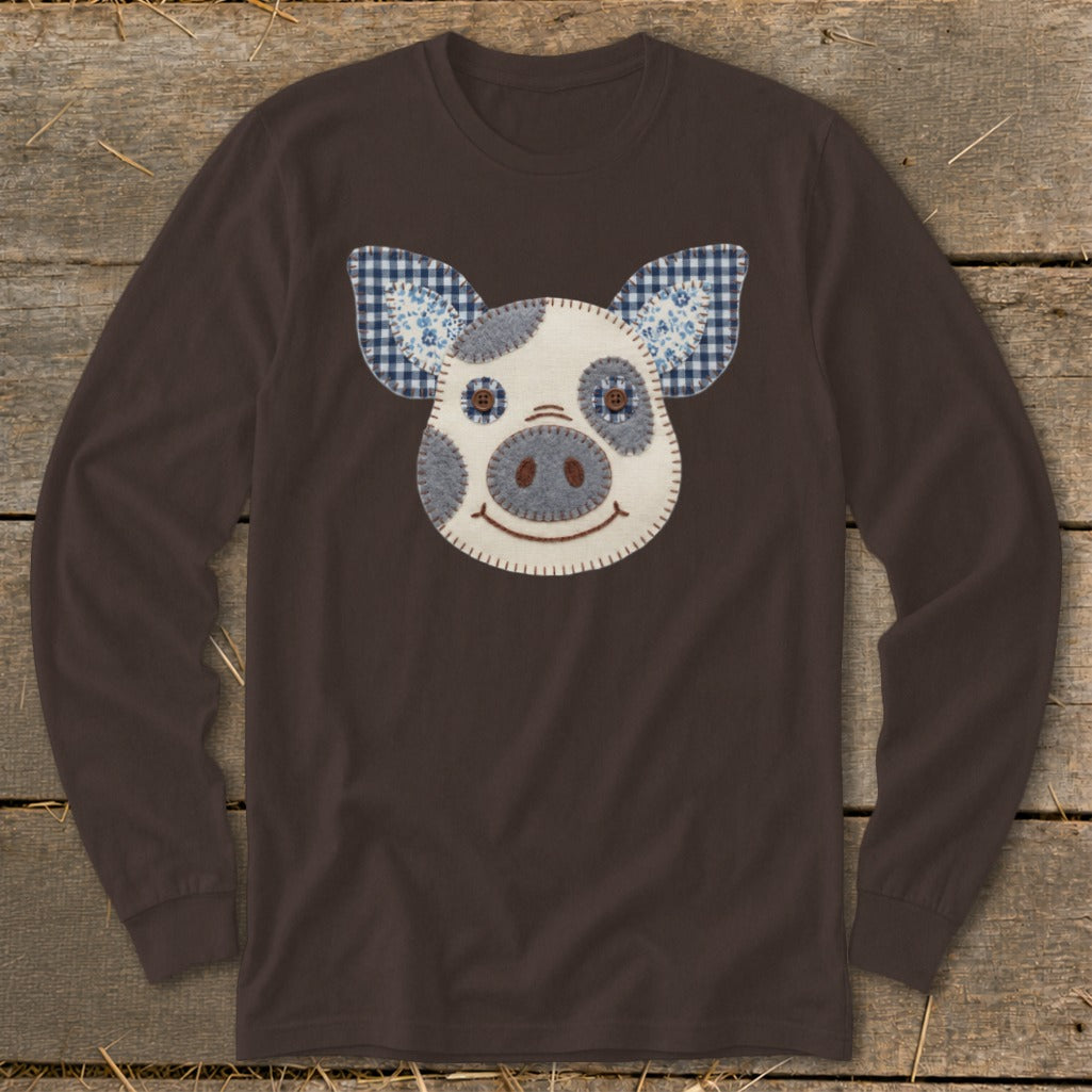 Brown long-sleeve shirt with a whimsical stitched pig face applique.