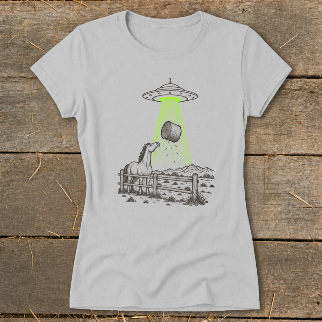 Line drawing of a horse in a pen being abducted by a UFO, taking a bale of hay.