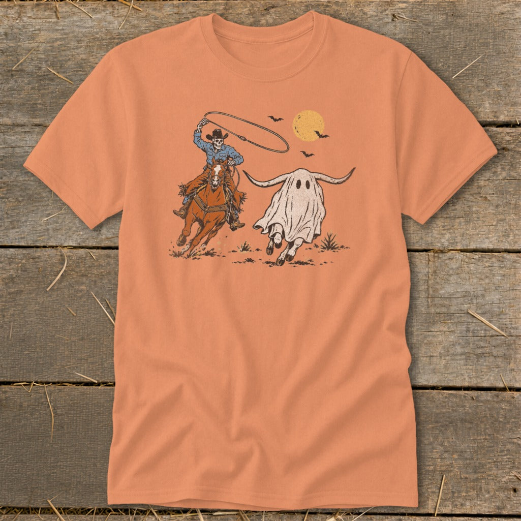 Skeleton cowboy on horse lassoing a ghost longhorn under a full moon.
