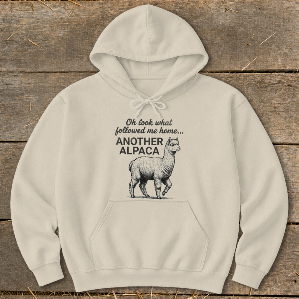 Cream hoodie with "Oh look what followed me home... ANOTHER ALPACA" text and alpaca illustration.