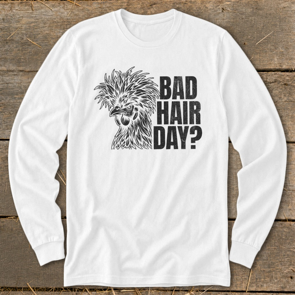 White long-sleeve shirt with a chicken graphic and text "BAD HAIR DAY?".