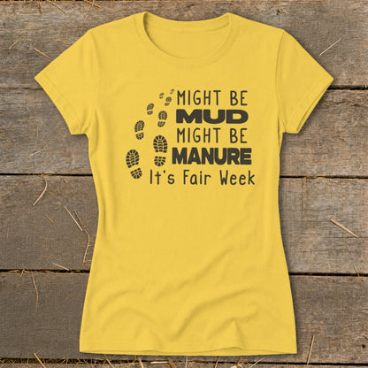 Yellow t-shirt with "Might be Mud, Might be Manure, It's Fair Week" text and footprints.