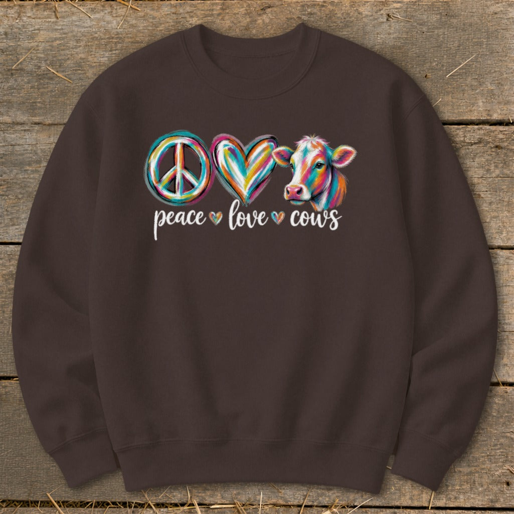 Peace, love, cows design with colorful peace sign, heart, and cow.