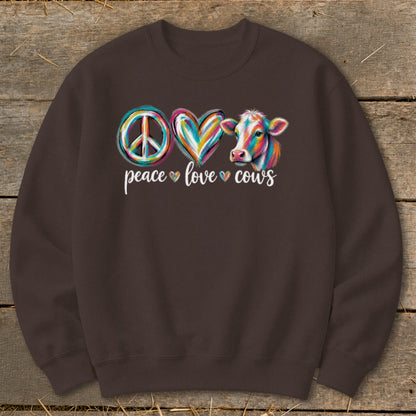 Peace, love, cows design with colorful peace sign, heart, and cow.