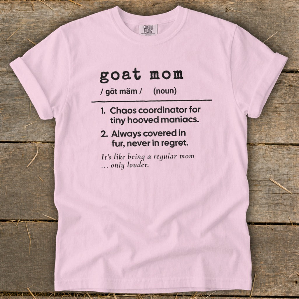 Pink t-shirt with black text defining "goat mom" as a chaos coordinator.