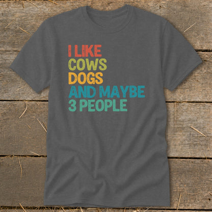 "I like cows, dogs, and maybe 3 people" text on a t-shirt.