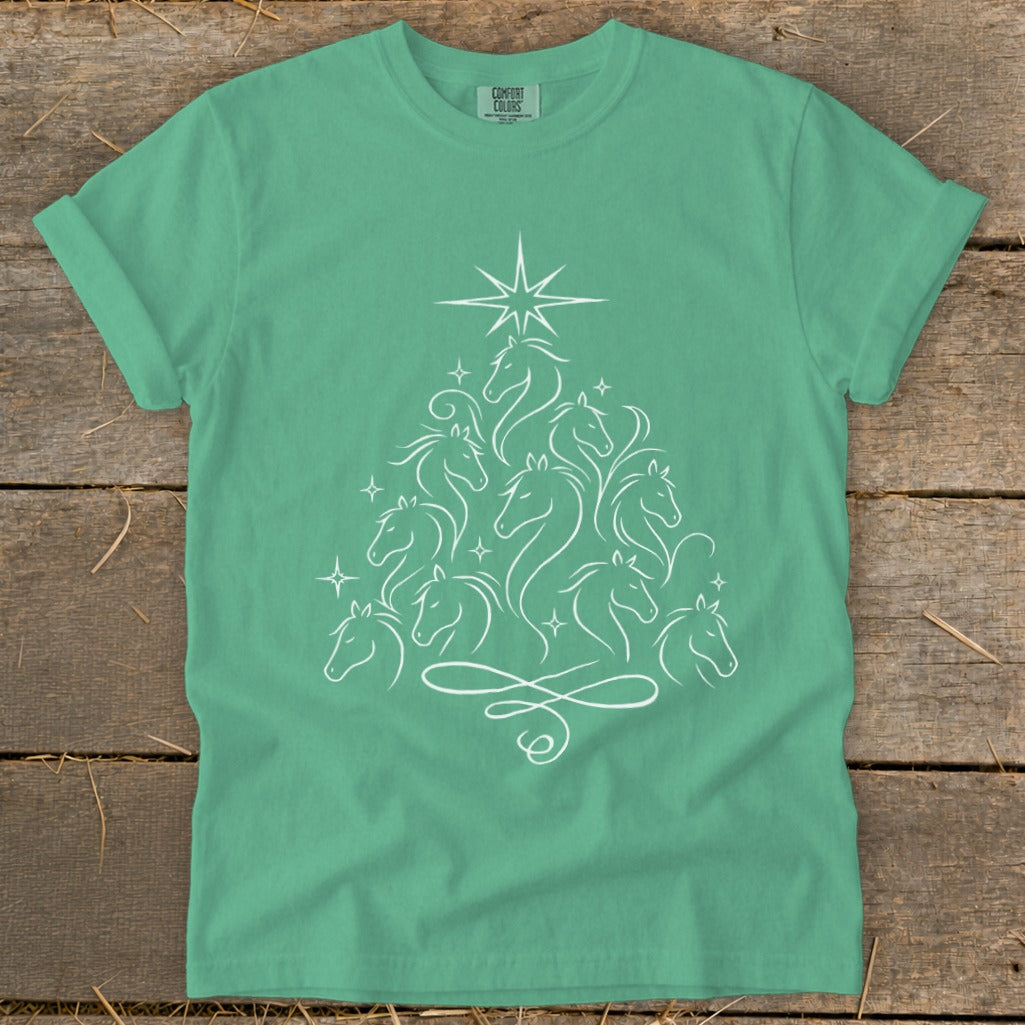 Teal t-shirt with white line art Christmas tree made of horses.