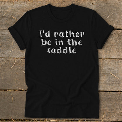 Black t-shirt with white text reading "I'd rather be in the saddle."