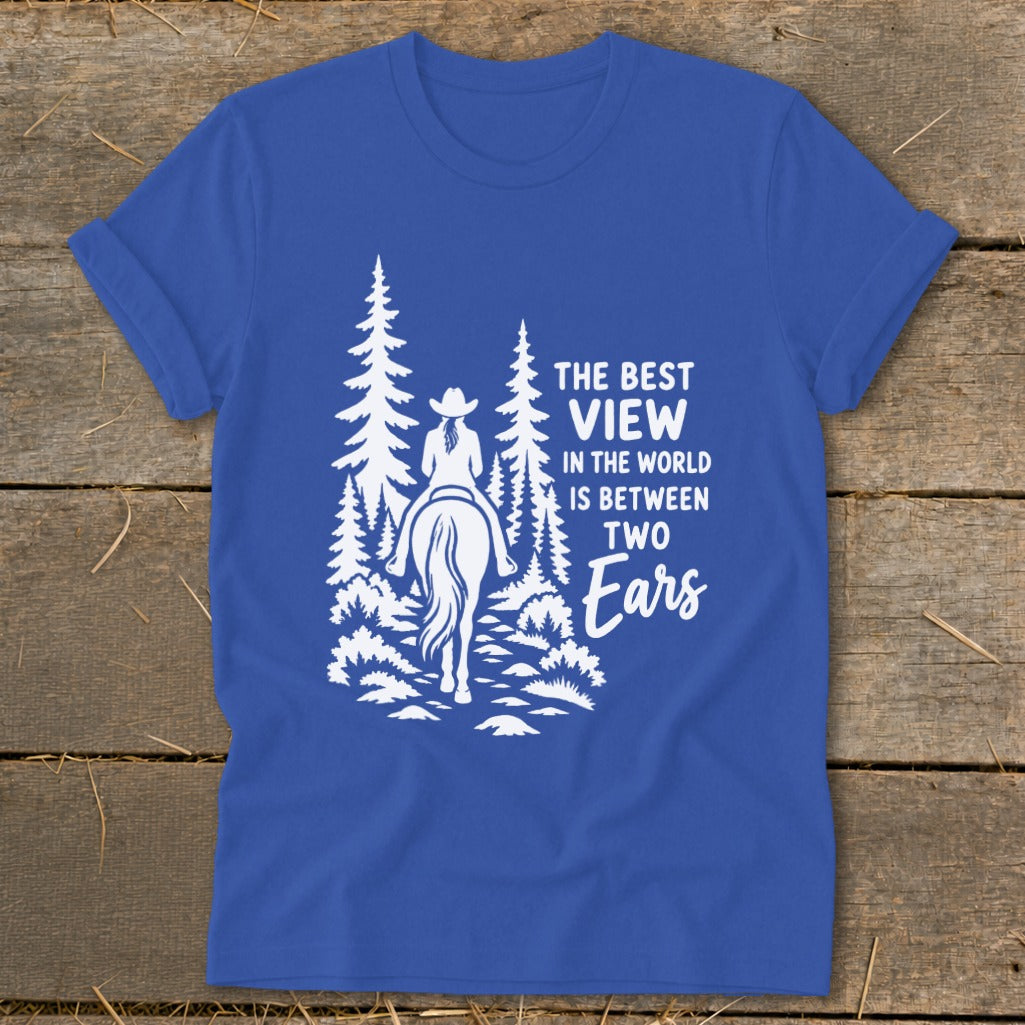 Royal blue t-shirt featuring a white graphic of a horseback rider and pine trees with text.